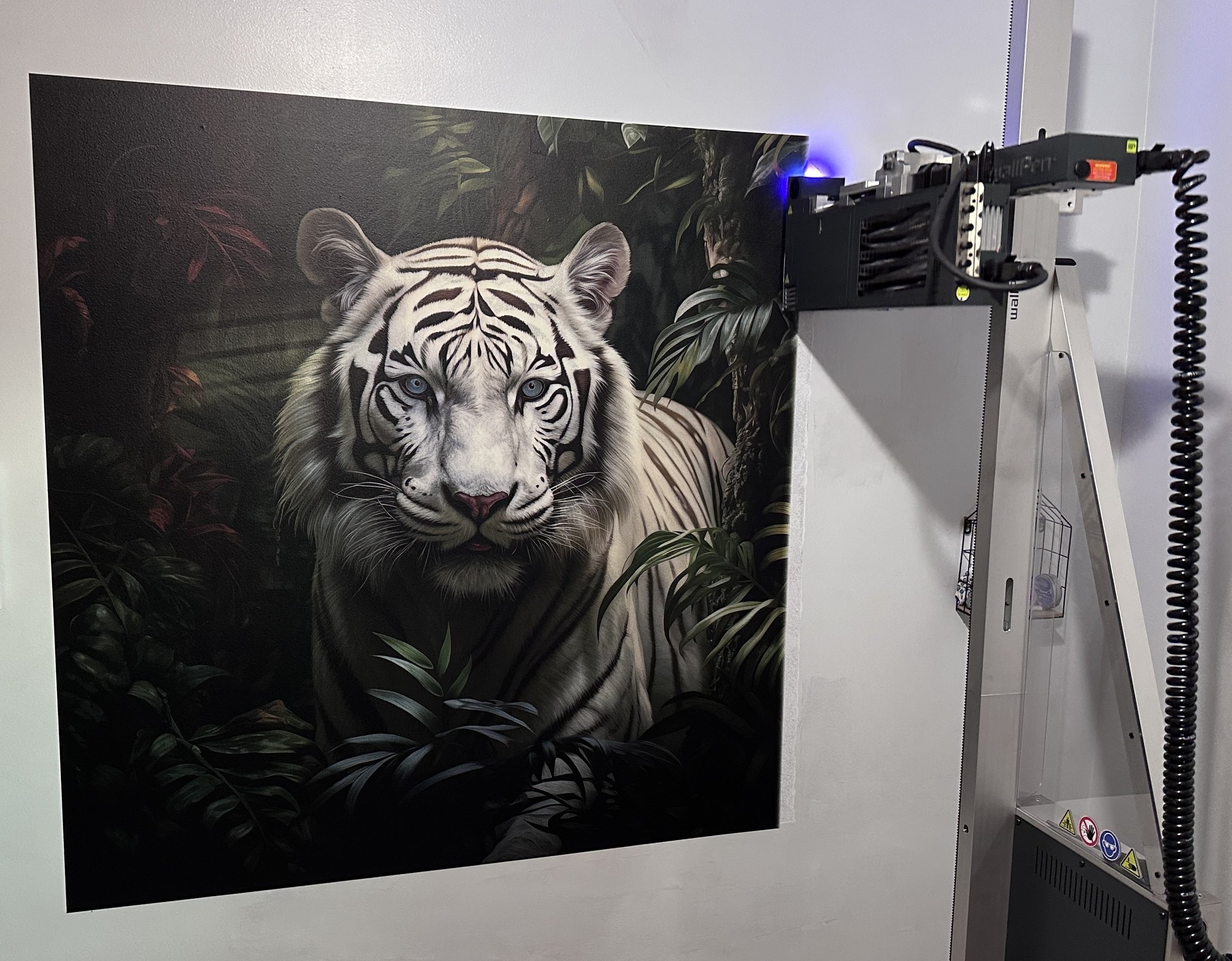 White tiger mural with the wallPen print head and upright rail visible beside it